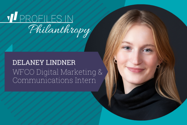 A professional headshot of Delaney Lindner against a teal background with diagonal stripes. She has long blonde hair, a warm smile, and is wearing a black turtleneck. The image includes the text "PROFILES IN Philanthropy" at the top and "DELANEY LINDNER, WFCO Digital Marketing & Communications Intern" on a purple banner overlapping her circular portrait.